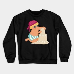 Cute little boy is on vacation building a sand castle on the beach, no background Crewneck Sweatshirt